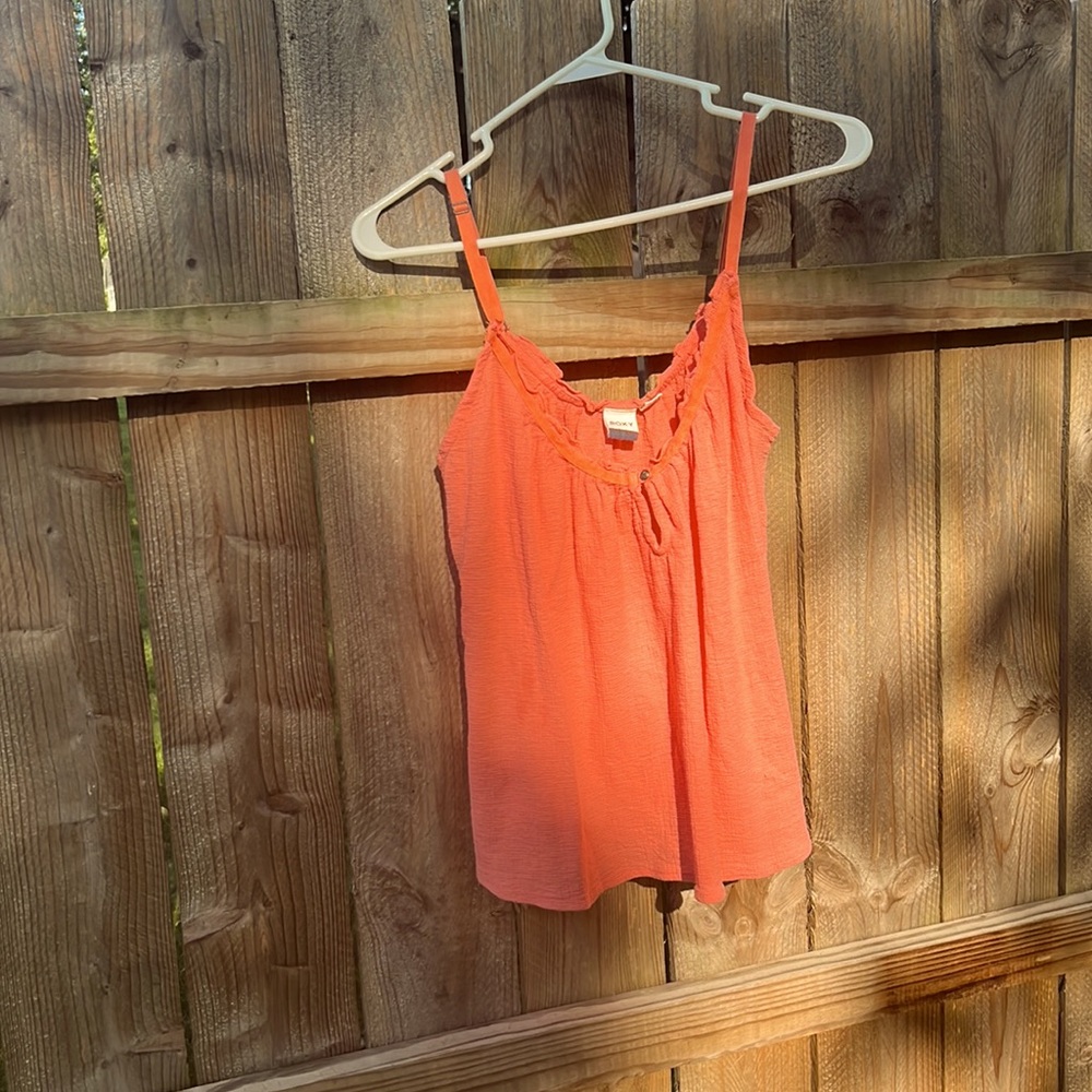 Roxy, blousy tank top, small but not a tight tank top.